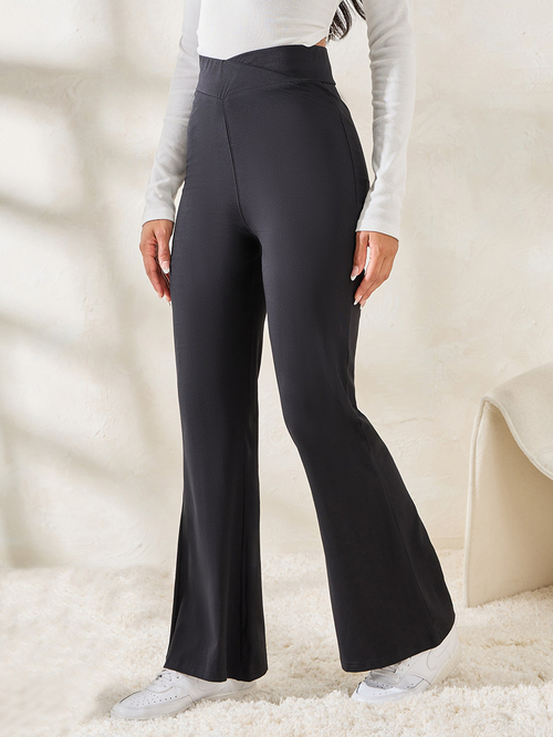 Buy Solid Criss Cross Waistband Fit Flare Leggings Black For Women Styli Saudi