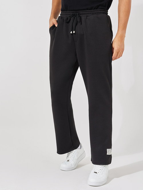 Buy Premium Bootcut Scuba Joggers with Badge Detail Black For Men Styli Saudi