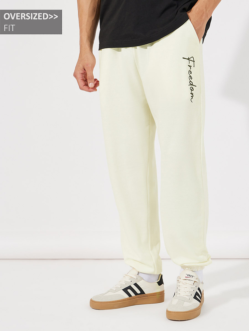 Buy Text Print Oversized Joggers Cream For Men Styli UAE