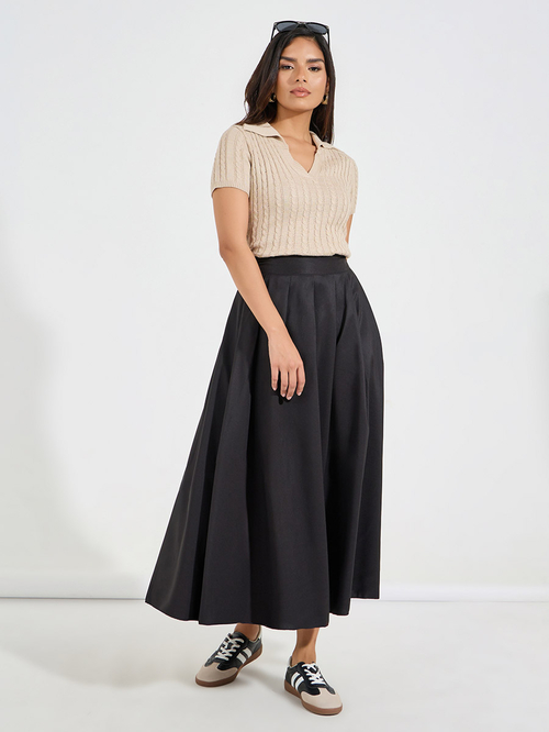Buy Solid Box Pleated Flared Maxi Skirt Black For Women Styli UAE