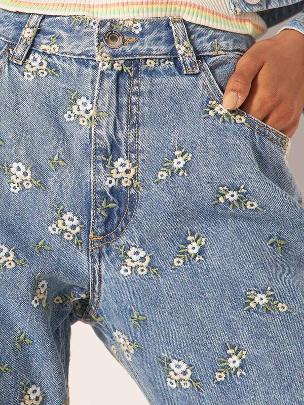 Buy All Over Floral Embroidered Flare Leg Jeans Blue For Women Styli UAE