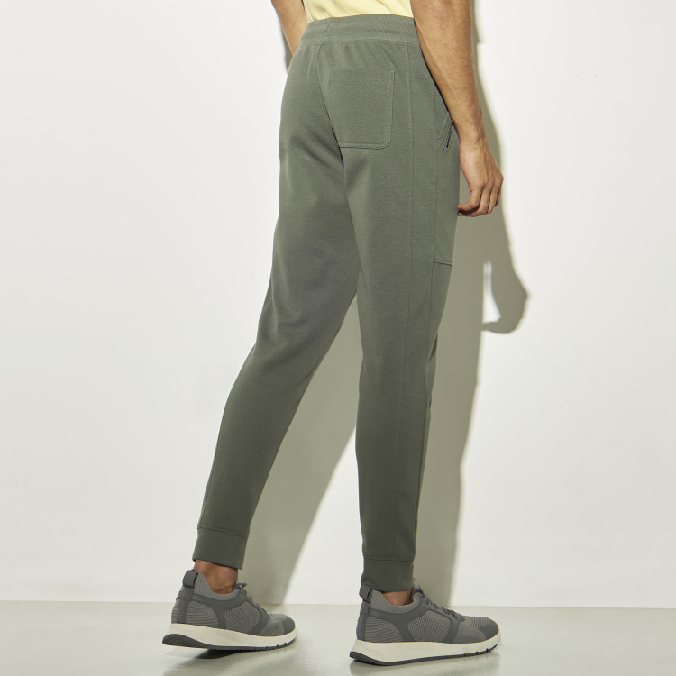 Buy Solid Jogger Pants with Zipper Pockets and Drawstring Closure