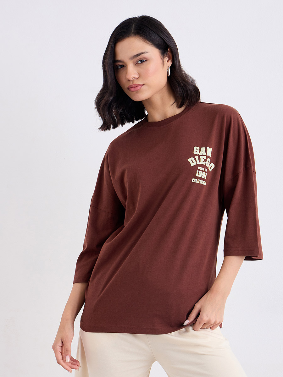 Brown Oversized Back Graphic Print T-Shirt For Women at Qatar Styli